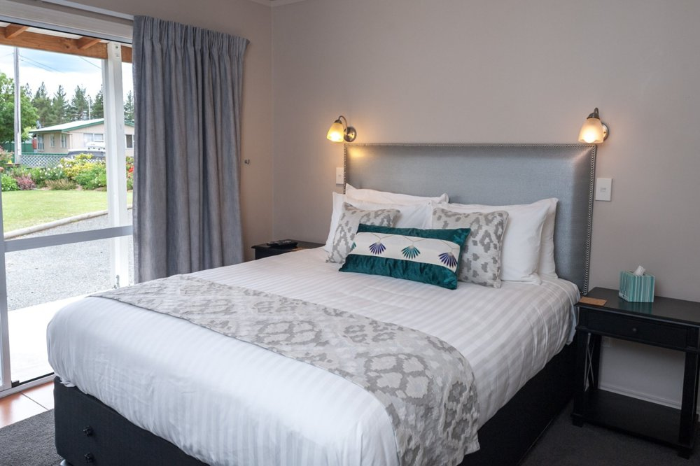 Bedroom with large bed and headboard